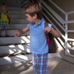 (Taking the stairs in the parking garage.  A big job for little legs.)