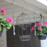 (Floating among the geraniums.)