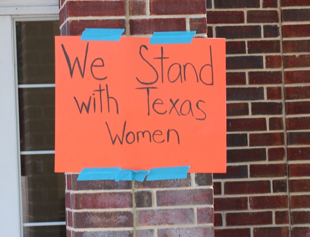 Walking with Cake: Texas Women sign