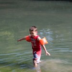 (James playing in the river.)