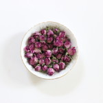 (Dried rosebuds in a vintage dish.)