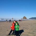 (Braving the cold at Haystack Rock in Cannon Beach.)