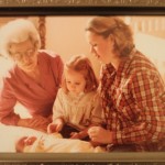 (My grandmother, my mom, and me, admiring my newborn sister.)