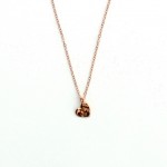 (Hammered Rose Gold Necklace by Project Dahlia, via Etsy.)